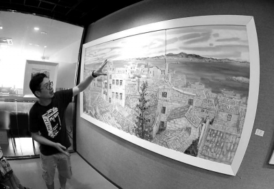 黃瑾毅向記者介紹《海島漁村》。